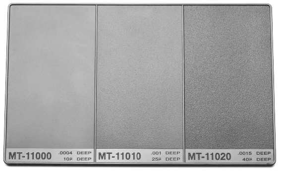Micro-etched injection molding texture board displaying multiple surface finishes for part design