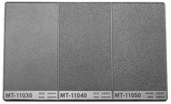 Micro-etched injection molding texture board displaying multiple surface finishes for part design