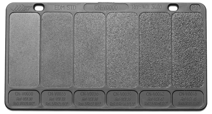 Injection molding texture board displaying multiple surface finishes for part design