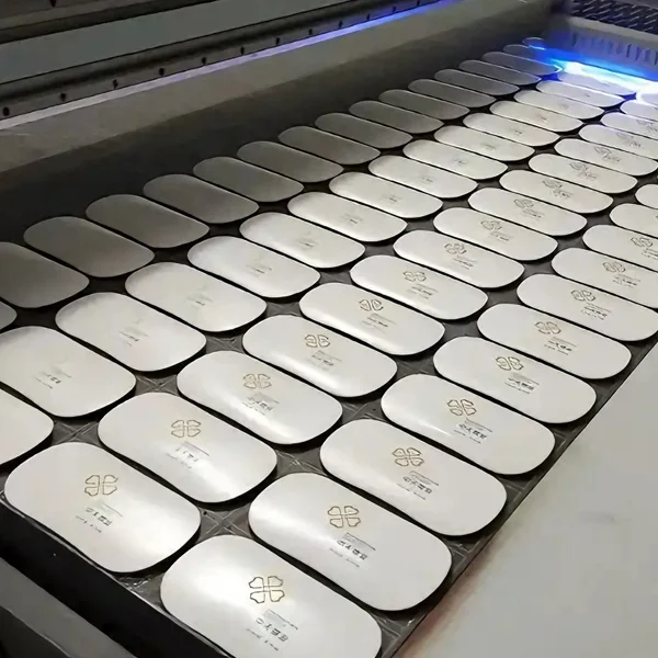 UV printing graphics on molded plastic parts