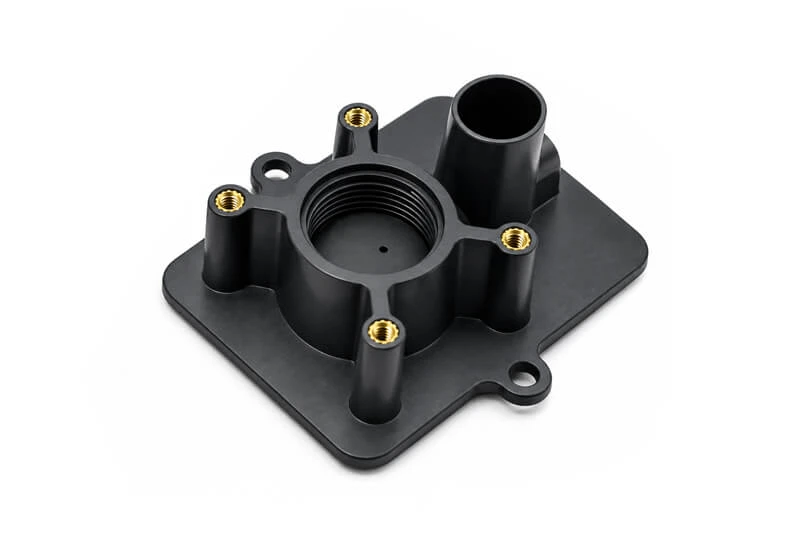 Insert molding process forming plastic around metal inserts