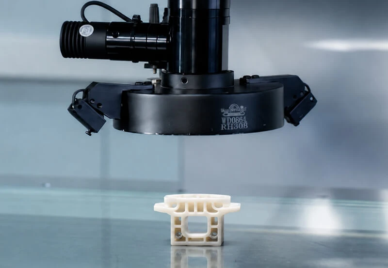 Quality assurance for insert-molded plastic–metal parts
